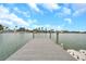 Picturesque waterfront view from a private wooden dock, offering serene water views and a tranquil atmosphere at 36 Dolphin Dr, Treasure Island, FL 33706