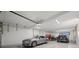 Spacious garage interior featuring parked cars, offering ample storage and parking at 36 Dolphin Dr, Treasure Island, FL 33706
