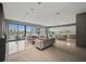 Open-concept living and kitchen area featuring modern decor, tiled floors, and expansive windows with waterfront views at 36 Dolphin Dr, Treasure Island, FL 33706