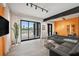 The spacious living room features modern decor, large windows, and access to outdoor amenities at 36 Dolphin Dr, Treasure Island, FL 33706