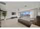 Large main bedroom with stunning waterfront views, sleek furniture, and modern finishes, a peaceful retreat at 36 Dolphin Dr, Treasure Island, FL 33706