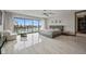Spacious main bedroom with scenic water views, a seating area, and modern decor at 36 Dolphin Dr, Treasure Island, FL 33706