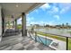 Relaxing outdoor patio with a waterfront view and comfortable seating, perfect for enjoying the scenery at 36 Dolphin Dr, Treasure Island, FL 33706