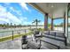 Serene outdoor patio with comfortable seating and stunning views of the waterfront and lush landscape at 36 Dolphin Dr, Treasure Island, FL 33706
