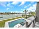 Modern pool and patio area with waterfront views at 36 Dolphin Dr, Treasure Island, FL 33706