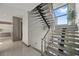 Modern staircase with sleek lines, open design, and abundant natural light creating an open atmosphere at 36 Dolphin Dr, Treasure Island, FL 33706