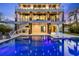 Modern pool with built-in spa and outdoor lounge chairs provide the ultimate in backyard relaxation at 36 Dolphin Dr, Treasure Island, FL 33706