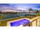 Pool with waterfront views and lush tropical landscape at 36 Dolphin Dr, Treasure Island, FL 33706