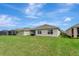 Picture of backyard and rear exterior showcasing well-maintained lawn and neighboring properties at 3720 Pebble Ter, Punta Gorda, FL 33980
