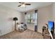 Bedroom with a window and a ceiling fan plus a TV and cabinet at 3720 Pebble Ter, Punta Gorda, FL 33980