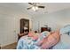 View of bedroom with queen bed, ceiling fan, closet and entry to another room at 3720 Pebble Ter, Punta Gorda, FL 33980