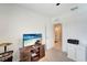 Bedroom with a TV and cabinet with an open doorway to an adjacent room at 3720 Pebble Ter, Punta Gorda, FL 33980