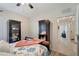Bedroom with coastal bedding and decor featuring two display cabinets at 3720 Pebble Ter, Punta Gorda, FL 33980