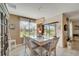 Bright dining room with white table set, decorative lighting fixture, and sheer curtains at 3720 Pebble Ter, Punta Gorda, FL 33980