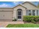 Inviting front entrance with a screened door, decorative shutters, and a brick walkway at 3720 Pebble Ter, Punta Gorda, FL 33980