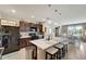 Spacious kitchen with quartz island, stainless steel appliances, and modern lighting at 3720 Pebble Ter, Punta Gorda, FL 33980
