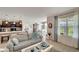 Inviting living room adjacent to dining area and kitchen, featuring stylish decor and natural light at 3720 Pebble Ter, Punta Gorda, FL 33980