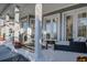 Covered outdoor patio with seating, columns, and neutral decor at 435 Manns Harbor Dr, Apollo Beach, FL 33572