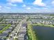 Aerial view of a waterfront neighborhood, showing many houses near multiple lakes at 43554 Treadway Dr, Punta Gorda, FL 33982