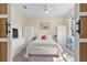 Bright bedroom features a ceiling fan, modern decor, and a comfortable bed with stylish bedding at 43554 Treadway Dr, Punta Gorda, FL 33982
