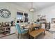 Bright dining area features a view of the screened patio, stylish decor and a beverage center for entertaining at 43554 Treadway Dr, Punta Gorda, FL 33982