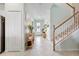 Welcoming foyer with tile flooring, a staircase, and an inviting view into the home at 43554 Treadway Dr, Punta Gorda, FL 33982