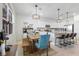 Bright kitchen features granite counters, stainless appliances, and an adjacent dining area with natural light at 43554 Treadway Dr, Punta Gorda, FL 33982