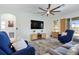Spacious living room features comfortable seating, stylish decor and a seamless connection to the outdoor area at 43554 Treadway Dr, Punta Gorda, FL 33982