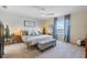 Serene main bedroom with a king bed, soft lighting, and tranquil views for restful nights at 43554 Treadway Dr, Punta Gorda, FL 33982
