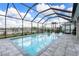 Enclosed pool and spa area with ample space for seating and relaxation at 43554 Treadway Dr, Punta Gorda, FL 33982