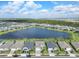 An overhead street view of several homes in a lakefront neighborhood at 43554 Treadway Dr, Punta Gorda, FL 33982