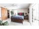 Bright bedroom with closet, ceiling fan, and access to the outdoors at 483 Corrientes Cir, Punta Gorda, FL 33983