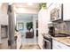 Open concept kitchen featuring stainless steel appliances and granite countertops at 483 Corrientes Cir, Punta Gorda, FL 33983