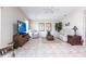 Living area with neutral tile flooring, comfortable furniture, and bright natural light at 483 Corrientes Cir, Punta Gorda, FL 33983