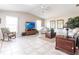 Open living room with vaulted ceiling, tile flooring, and large windows at 483 Corrientes Cir, Punta Gorda, FL 33983