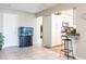 Open concept living area with aquarium and breakfast bar adjoining the kitchen at 483 Corrientes Cir, Punta Gorda, FL 33983