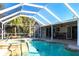 Stunning screened-in pool and spa area with ample seating and clear blue water at 483 Corrientes Cir, Punta Gorda, FL 33983