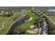 Overhead view showcasing the golf course, water feature, and neighborhood at 1340 San Cristobal Ave # 304, Punta Gorda, FL 33983