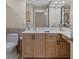 Well-lit bathroom with vanity and a decorative wall mirror at 1340 San Cristobal Ave # 304, Punta Gorda, FL 33983