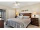 Comfortable bedroom featuring a wooden headboard and side tables with lamps at 1340 San Cristobal Ave # 304, Punta Gorda, FL 33983