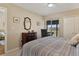 Bedroom with a dresser, balcony access and a view at 1340 San Cristobal Ave # 304, Punta Gorda, FL 33983