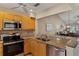 The kitchen features stainless appliances, granite counters, and an open breakfast bar overlooking the living areas at 1340 San Cristobal Ave # 304, Punta Gorda, FL 33983