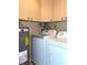 Well-equipped laundry area with modern washer, dryer, and water heater at 1340 San Cristobal Ave # 304, Punta Gorda, FL 33983