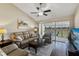 Inviting living room with vaulted ceiling and enclosed lanai access at 1340 San Cristobal Ave # 304, Punta Gorda, FL 33983