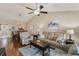 Inviting living room features wood floors, a ceiling fan, and comfortable seating for relaxing and entertaining at 1340 San Cristobal Ave # 304, Punta Gorda, FL 33983