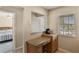 Convenient office nook with granite counters, built-in cabinets, and a window with natural light at 1340 San Cristobal Ave # 304, Punta Gorda, FL 33983