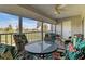Relaxing enclosed patio with ceiling fan and views of the golf course at 1340 San Cristobal Ave # 304, Punta Gorda, FL 33983
