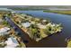 Stunning aerial view of waterfront homes with private docks and lush landscaping on a sunny day at 2012 River Basin Ter, Punta Gorda, FL 33982