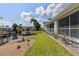 Waterfront backyard featuring a gazebo, lush lawn, landscaping and direct access to the canal, perfect for relaxation at 2012 River Basin Ter, Punta Gorda, FL 33982