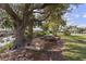 Relaxing backyard area with a swing, picnic table and views of the serene canal at 2012 River Basin Ter, Punta Gorda, FL 33982